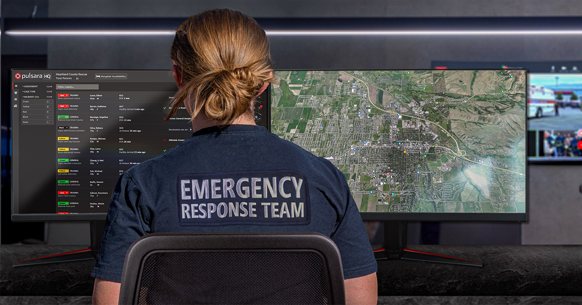 emergency response team member managing an incident from a desktop computer