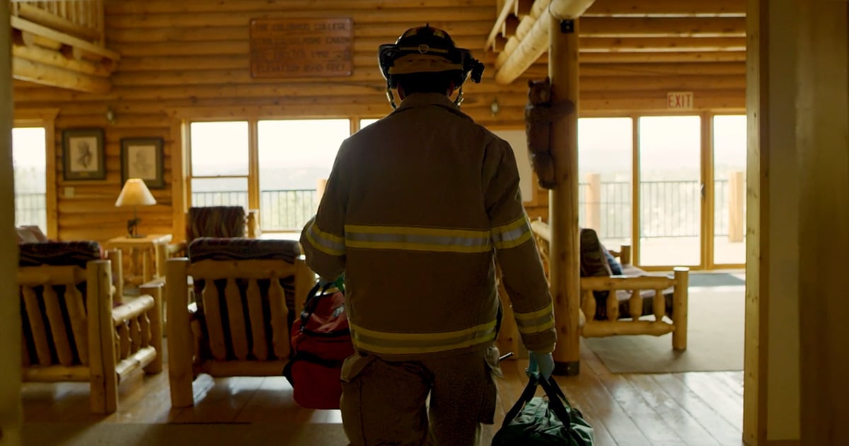 a firefighter enters a patient's home for a community paramedicine call