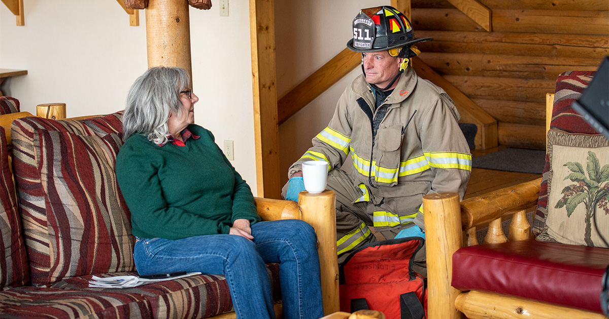 a first responder visits a patient in her home