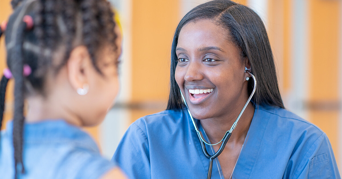 a nurse examines a pediatric patient